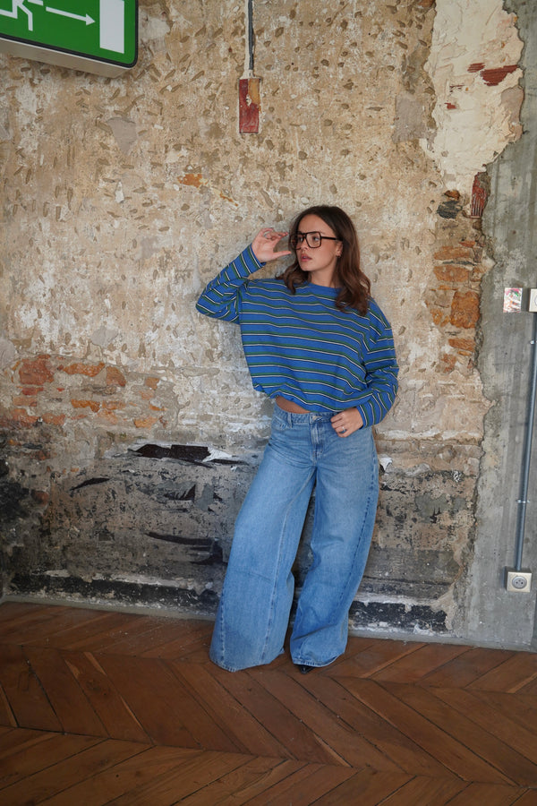 Green and blue striped sweater